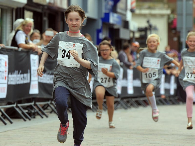 Ellie-Rae Hutchinson, eight, is pictured winning her race in style.
