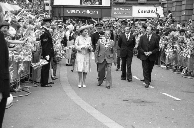 Thousands congregated in the marketplace to see the Queen.