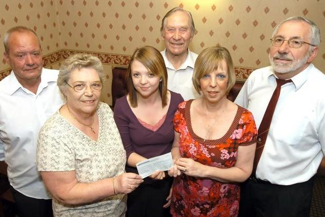 Barbara Sumner, second left and Lynne Hutchinson, second right, trustee of Clipstone Social Club, present a cheque for £500 to Emma Dallman at the club.