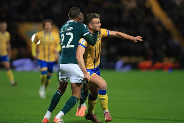 Rhya Oates is halted during the Sky Bet League 1 match against Plymouth Argyle FC at the One Call Stadium, 28 Oct 2025, Photo credit Chris & Jeanette Holloway / The Bigger Picture.media