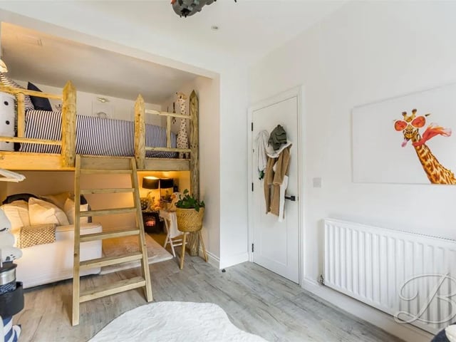 Accessed through an interior fire door and complete with a beautiful mezzanine bed utilising the space of the room with wooden flooring, window to rear elevation, spot lighting, TV point and central heating radiator.
