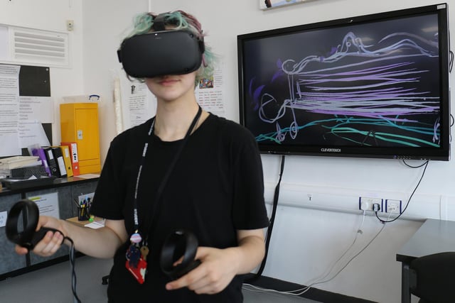 Art and design student River Smith paints in 3D using a VR headset and hand-held controller.