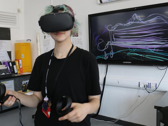 Art and design student River Smith paints in 3D using a VR headset and hand-held controller.