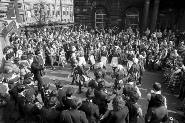 The Sandgate Morris dancers at the Mercat Cross during Edinburgh Folk festival March 1982.