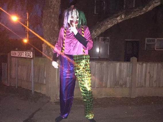 Images of clowns around the Mansfield area are circulating on Facebook. This clown was seen waving to motorists in Mansfield Woodhouse. (Source: Facebook).
