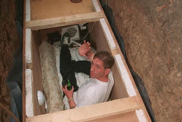 Geoff was confined to a 7ft wooden box with a television and family photos to make him feel at home.
