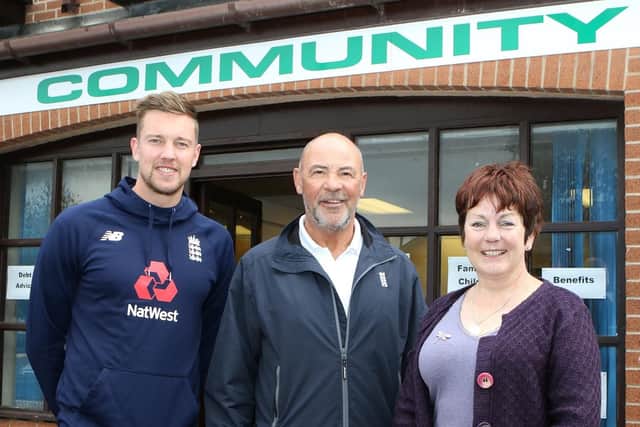 Notts and England cricketer Jake Ball and international umpire Tim Robinson dropped in to help Helen Hollis open the new Community Help Centre on Market View