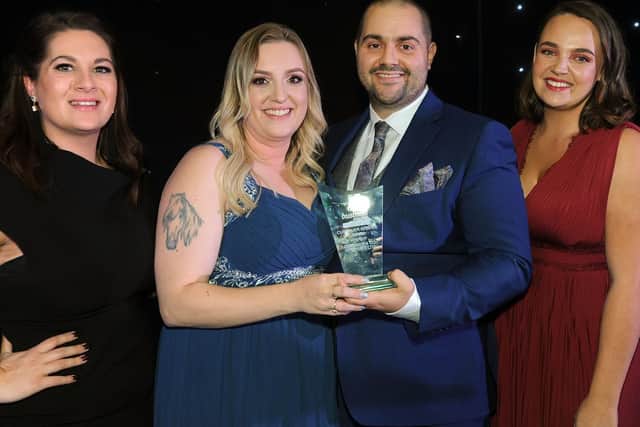 Customer Service Award winners, O'Connor and Co. Removals Ltd, receive their award from Amber Woodcock of JPIMedia Ltd, right, and host Ashleigh Porter-Exley.