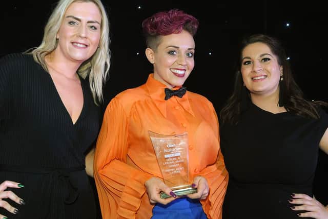 Leisure and Lifestyle Award winners, Pretty Heavy Lifters receive the award from Samantha Daley, left, of JPIMedia Ltd.