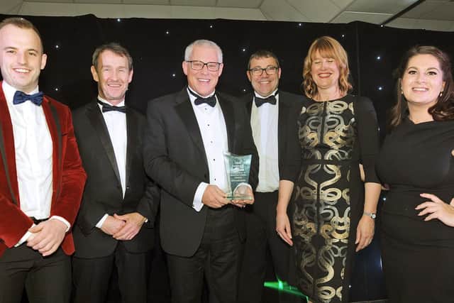 Winners of the Excellence in Manufacturing Award winners, Whitemeadow, pick up their award from James Middleton of Middleton Structures.