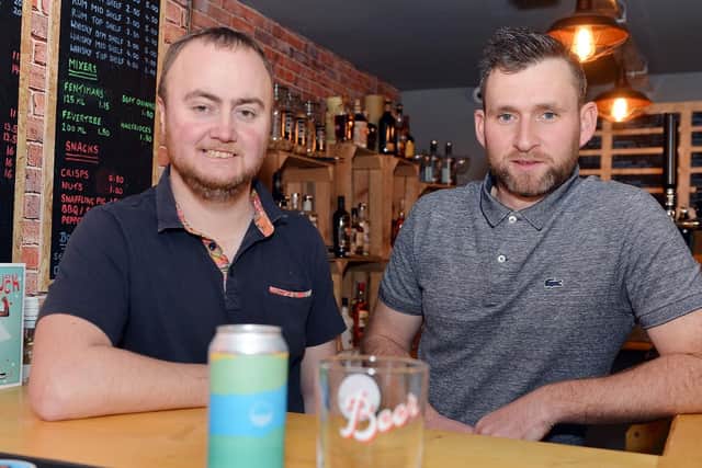 Neil Beaver and Danel Hallam behind the bar of FireRock, which opens today