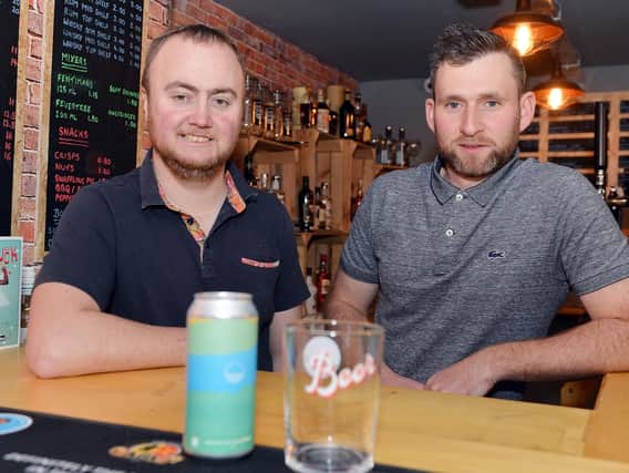 Neil Beaver and Danel Hallam behind the bar of FireRock, which opens today