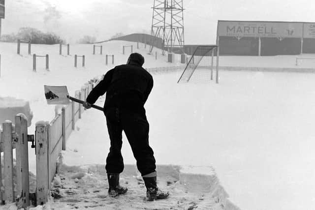 Attempting to clear the pitch - 1961.