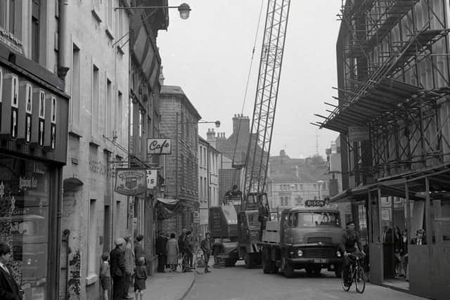 An image taken in 1965 showing work on the CO-OP building, now Beales on the right. On the left are buildings before the Four Seasons was built.