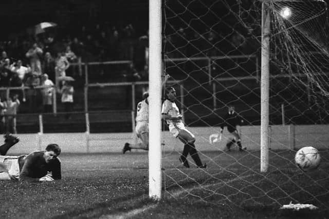 Neil Whatmore (no.9) celebrates scoring.