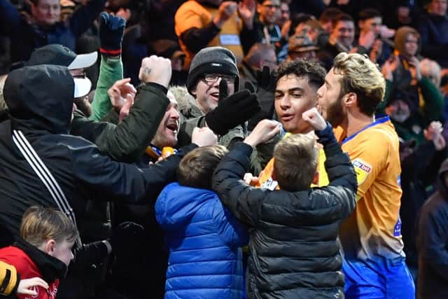 Tyler Walker celebrates with fans.