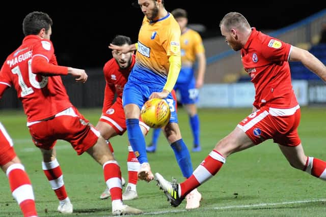 Jorge Grant chips the ball over the Crawley defence.