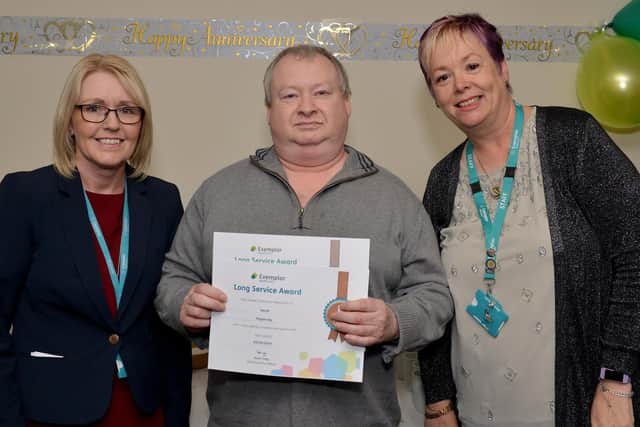 David Pepperday receiving his long service award from clinical director Helen Baxendale and head of health and safety Melanie Phillips
