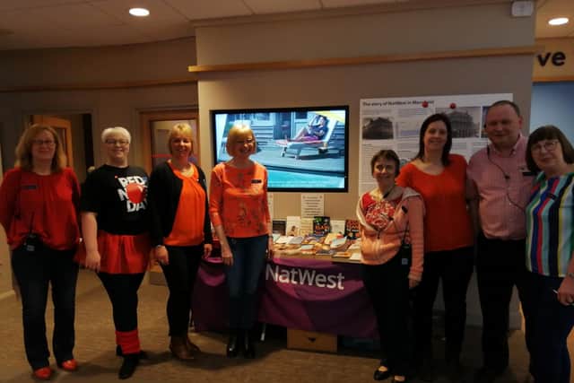 Pictured are staff from Natwest in Mansfield, who organised a book sale for Comic Relief.