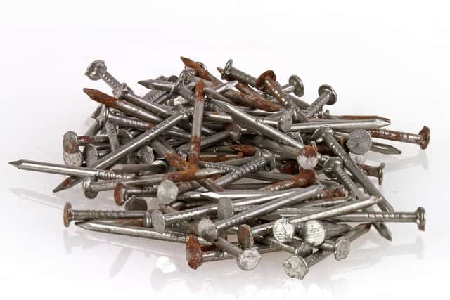 Grass needs iron to make chlorophyll, so  throw some rusty old nails into a watering can to quickly create an iron-rich solution to water the lawn with.