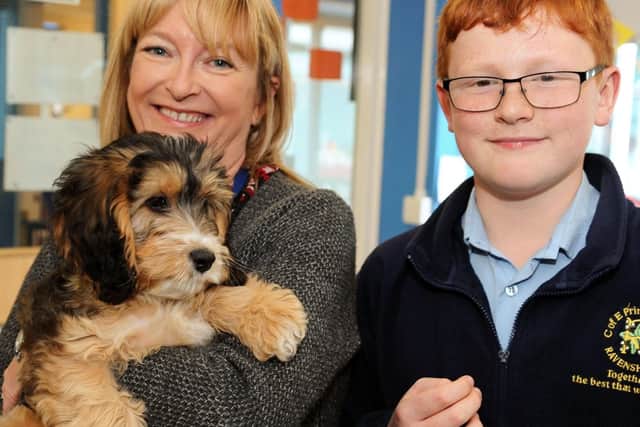 Head teacher, Helen Thomas with year six pupil Euan who suggested that Ravenshead Church of England Primary School get a dog.
