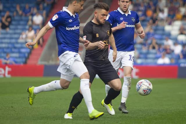 Match action from Mansfield's 3-2 defeat at Oldham.