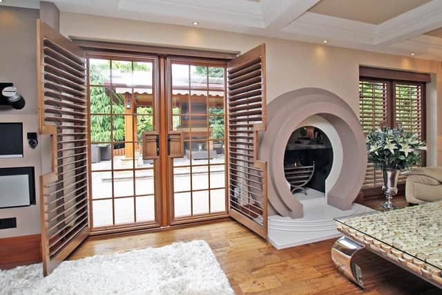 The bespoke doors lead out to the rear patio area.