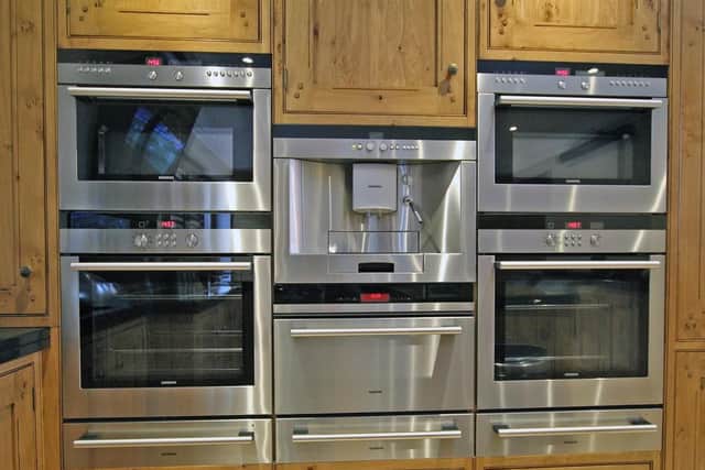 The kitchen has bespoke built-in appliances.