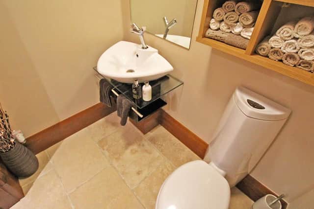 Even the downstairs toilet has the look of a five-star hotel.