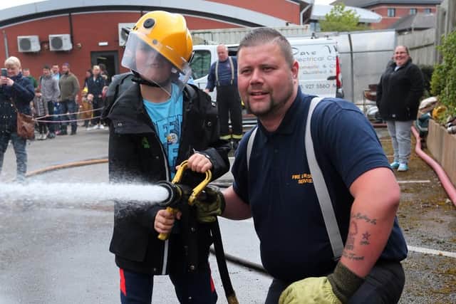 Thomas Hallgarth knocks over the cones helped by Dan Buxton of the Mansfield fire station preservation group.