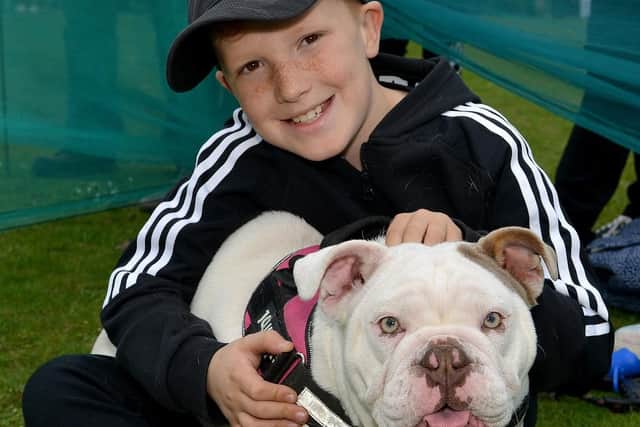 Oliver Gadsby, nine, with nine month old puppy Mabel