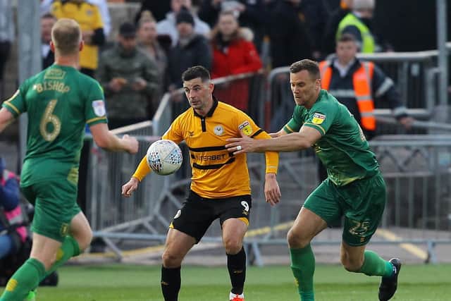 Ben Turner keeps close tabs on Padraig Amond