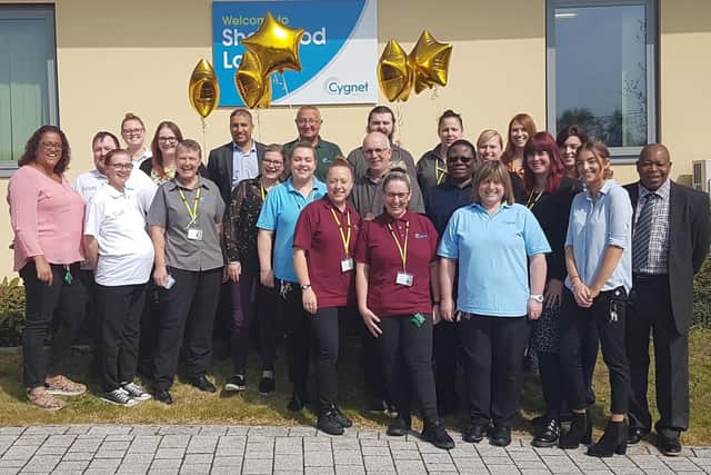 The team at Sherwood Lodge celebrate their 'outstanding' CQC rating across all five categories.