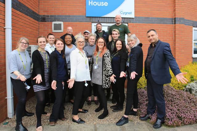 The team at Sherwood House celebrate their 'outstanding' rating from the CQC.
