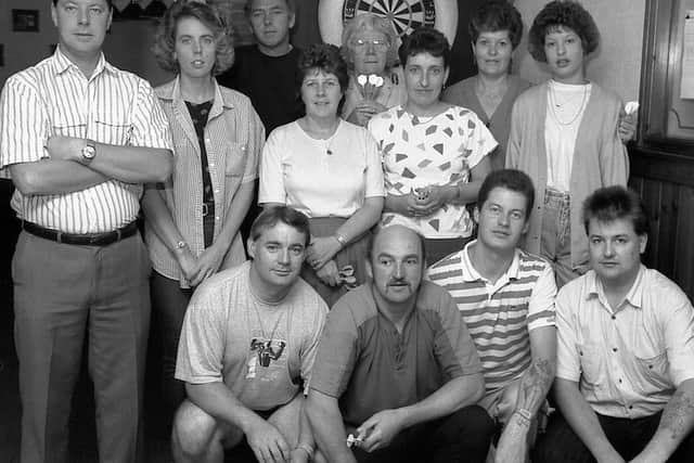 1989: This lovely group shot was taken before or after the Ram Inns darts marathon. Are you on this picture?