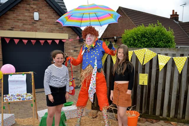 Pictured with Mr Tumble scarecrow are Macey Dring, eight and Alix-May Allsop, eight.