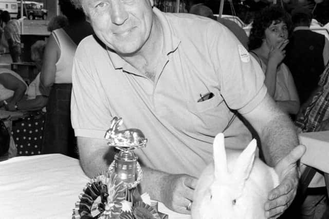 1990: A proud owner with his winning rabbit and trophy pictured at the Mansfield Show. Did you go to this event?
