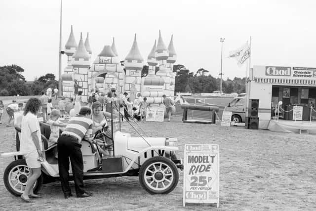 1990: A fabulous nostalgic shot snapped at the Mansfield Show featuring Model T rides and a bouncy castle. Did you have a go in this car?