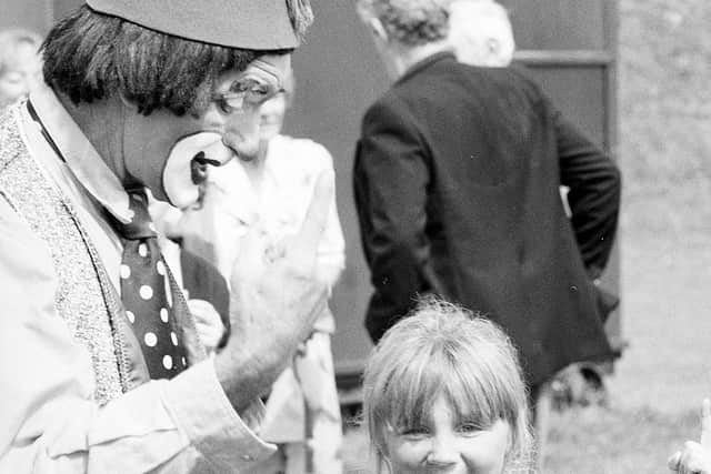 1990: This clown has given this little girl the giggles at Mansfeld Carnival. Were you there?