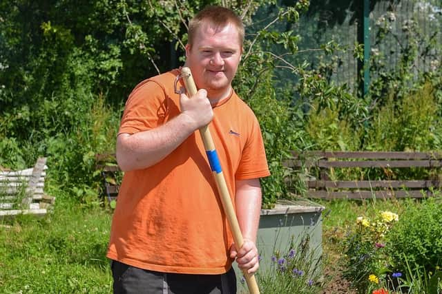 Rhubarb Farm open day for Nottinghamshire National Gardens Scheme, pictured is Connor Dale tending the flowerbeds.