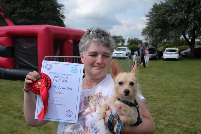 Paula Wright holds Oscar, who won a dog competition.