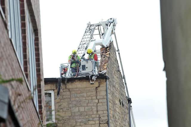 Firefighters handle the damage.