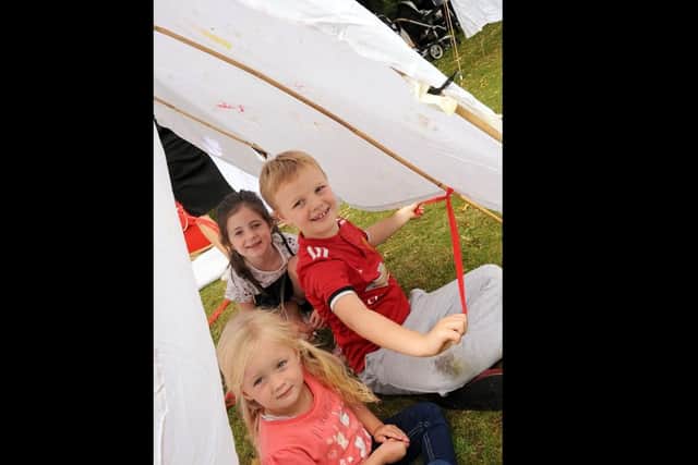 Millie Sorrell, 7, Louis Pearson, also 7 and 3 year old Amari Henshaw in their den which they built with help from mums.