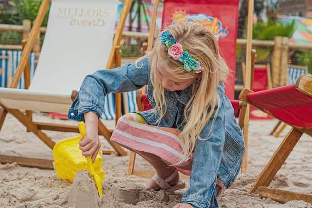 On Old Market Square. Many of the thrilling rides and sideshows will cost you money but general admission to the beach is free. Get ready for some family fun on the sand until September 1.