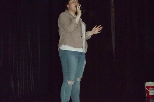 Lowri Davies sings on stage at the final, which was held at Forest Town Area