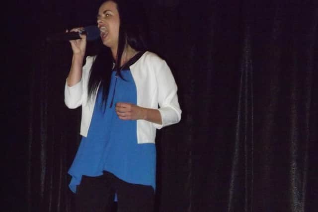 Natalia Sidvzik sings to the audience