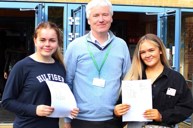 Jodi and Jessica James with Mr Maher the head teacher.