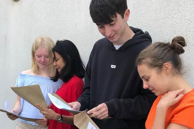 Molly Marsden, Ei Lwin, Thomas Waldron and Halcyon Matthews open their results.
