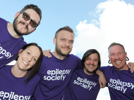 Wayne Pettinger, Danielle and Mark Kemp, Jamie Snarski and Jason Berrow get acquainted with the clouds ahead of their parachute jump for the Epilepsy Society. Picture by Anne Shelley.