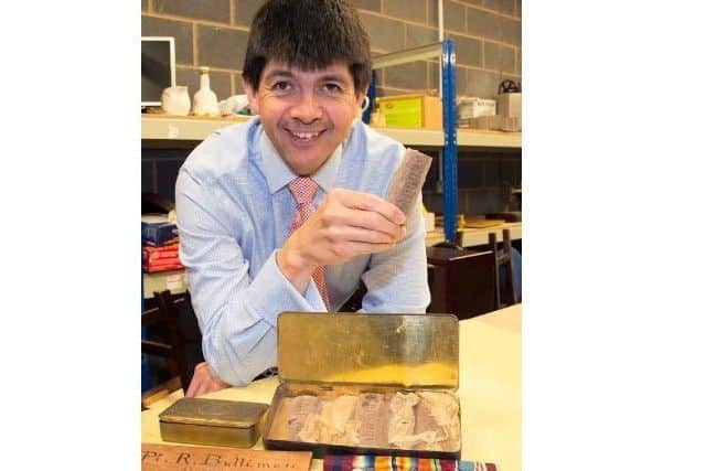Paul Cooper pictured with the tin and chocolate.